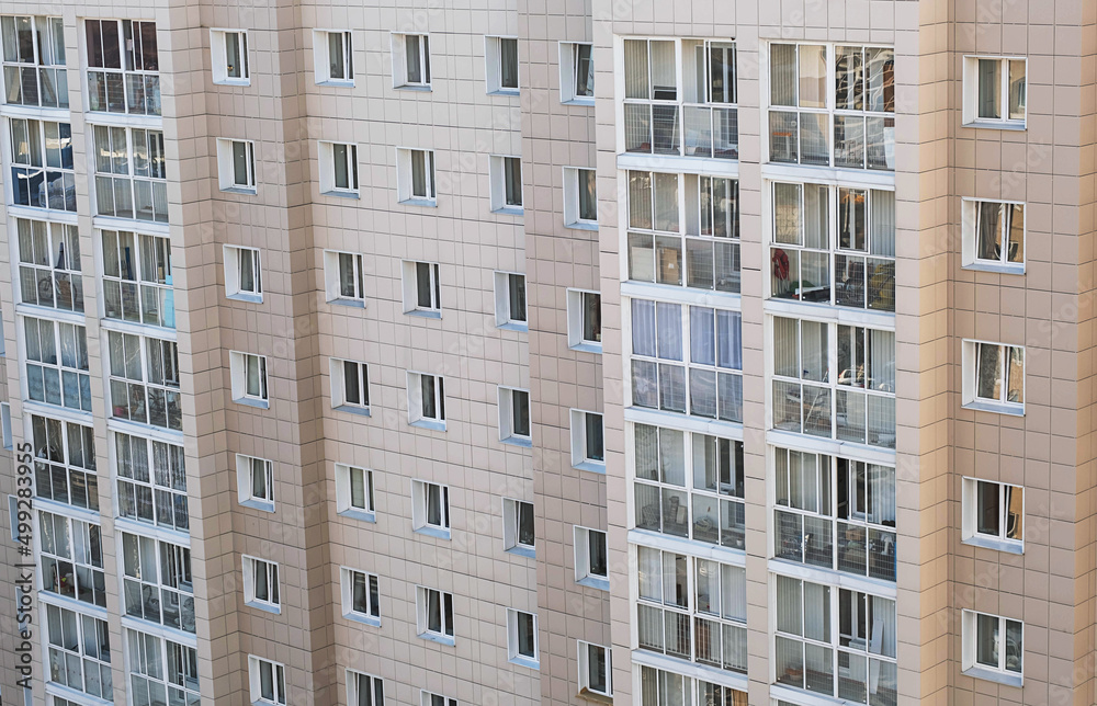 Contemporary real estate building, close up. Residential apartment building facade.