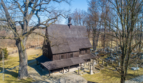 St. Leonard's Gothic wooden church in Lipnica Murowana in Lesser Poland. Built in the 15th century. UNESCO World Heritage Site. Wooden soboty (undercut supported by pillars) and cemetery. Aerial view photo
