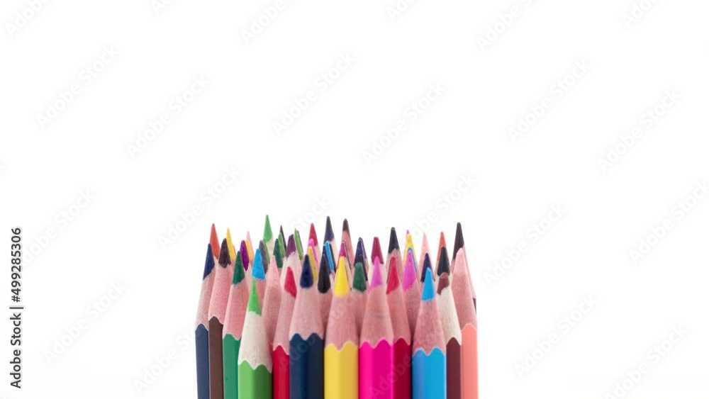 A bunch of multi-colored wooden pencils on a white background with the word open changing to closed. Stop motion animation. A bunch of multi-colored wooden pencils on a white background with the word open changing to closed. Stop motion animation.
