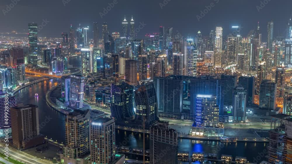 Skyline with modern architecture of Dubai business bay towers night timelapse. Aerial view Skyline with modern architecture of Dubai business bay towers night timelapse. Aerial view