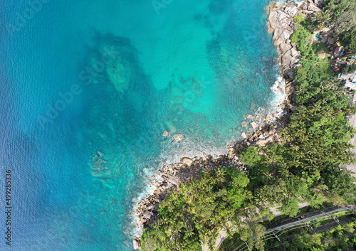 Amazing top view seashore Aerial view of Tropical sea in the beautiful Phuket island Thailand. Travel and business tour website background concept