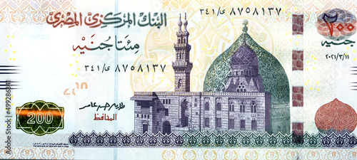 Large fragment of the obverse side of 200 LE two hundred Egyptian pounds banknote series 2021 features Qani-Bay mosque in Cairo Egypt, selective focus of Egypt cash money bill by central bank of Egypt photo