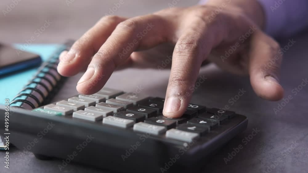 slow motion of accountant using calculator on office desk. slow motion of accountant using calculator on office desk.