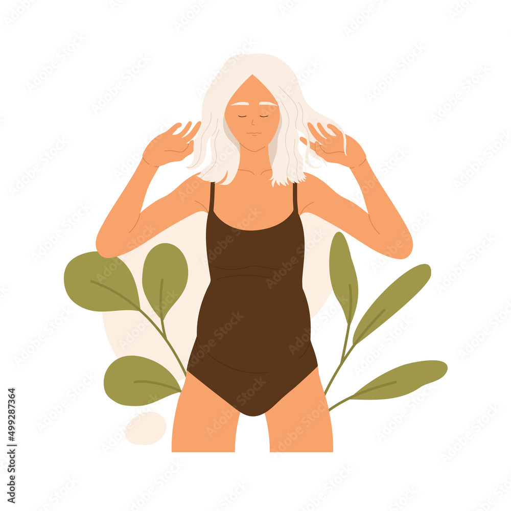 Young pregnant woman in a brown swimsuit is standing and sunbathing. Resting girl on the beach