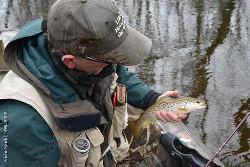 An angler with a brown trout 