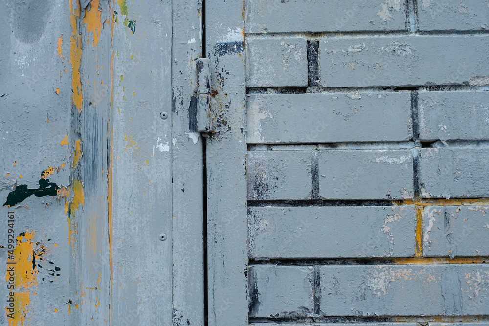 The texture of the brick wall is covered with old paint The texture of the brick wall is covered with old paint