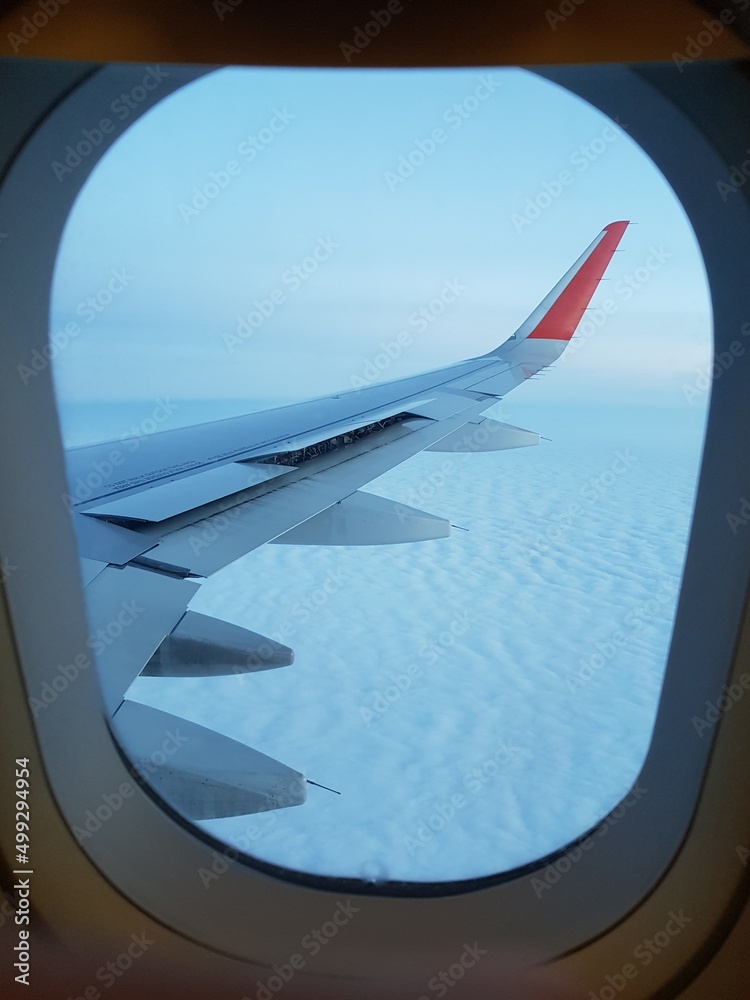 Airplane wing in the blue sky Airplane wing in the blue sky