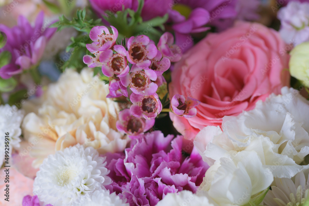 Decorative bouquet of many different small and large flowers