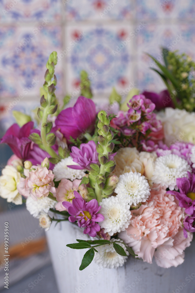 Decorative bouquet of many different small and large flowers