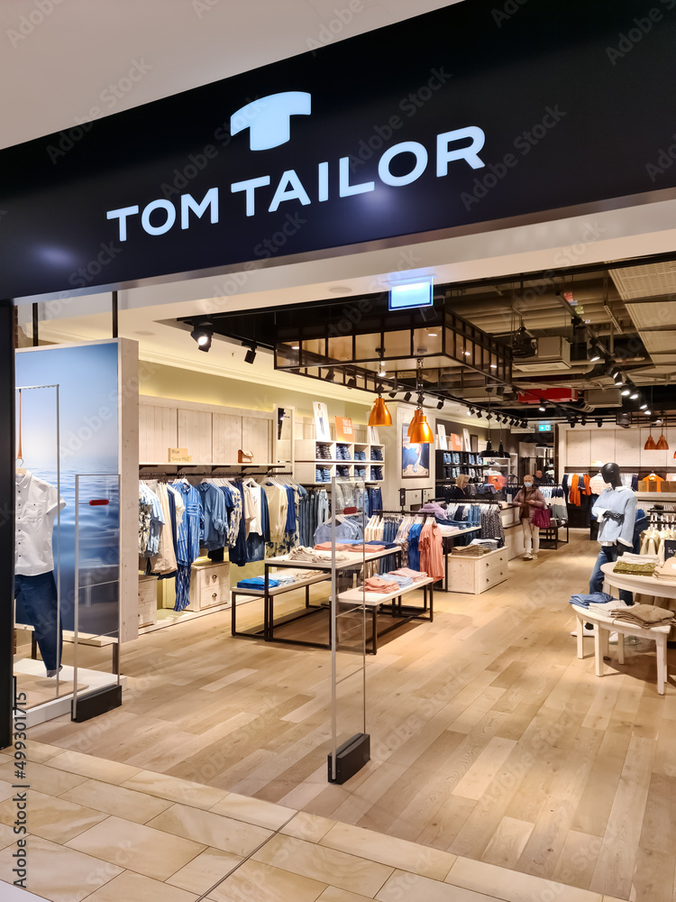 Neumuenster, Germany - 16. April 2022: Entrance area of a Tom Tailor  fashion store in a german city center. Stock Photo | Adobe Stock