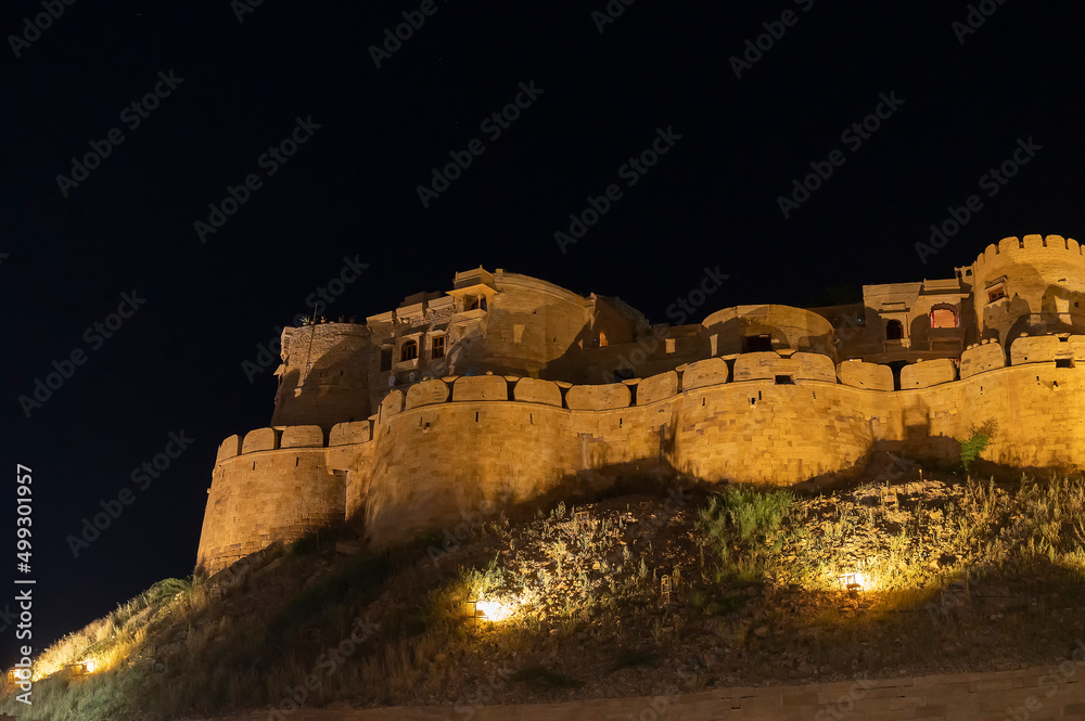 Jaisalmer,Rajasthan,India - October 15, 2019 : Jaisalmer Fort or Sonar Quila or Golden Fort, made of yellow sandstone, in the afternoon light. UNESCO world heritage site at Thar desert.