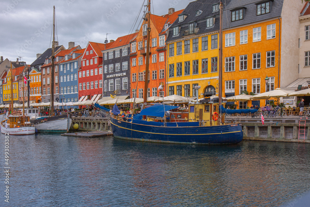 Colorful houses and boats on the embankment of the canal in the Nyhavn