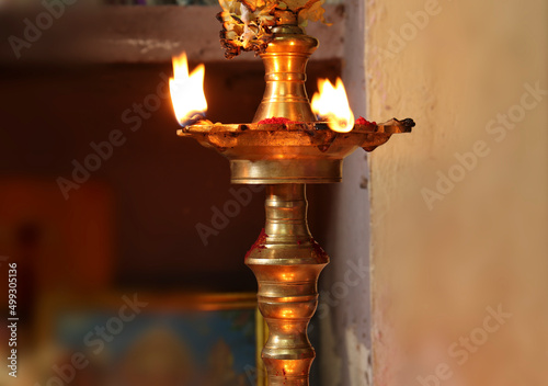 Indian Traditional Silver Oil Lamp Varalakshmi, Kuthu Vilakku, Brass Traditional Ornamental Lamp. with blur background