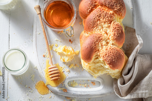 Healthy and sweet golden challah with honey and milk. photo