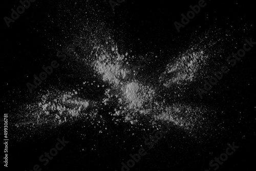White powder isolated on black texture, top view with clipping path