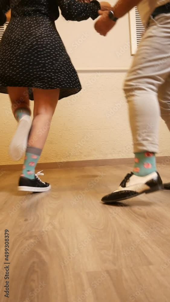 A senior adult couple dancing Lindy Hop in a studio A senior adult couple dancing Lindy Hop in a studio