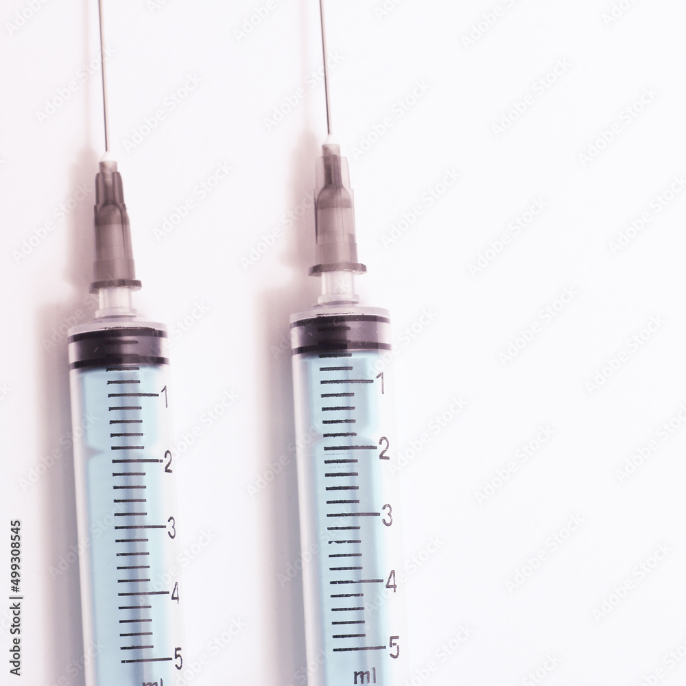 Medical syringe on a white background. A syringe for injection. The concept of health and beauty Medical syringe on a white background. A syringe for injection. The concept of health and beauty