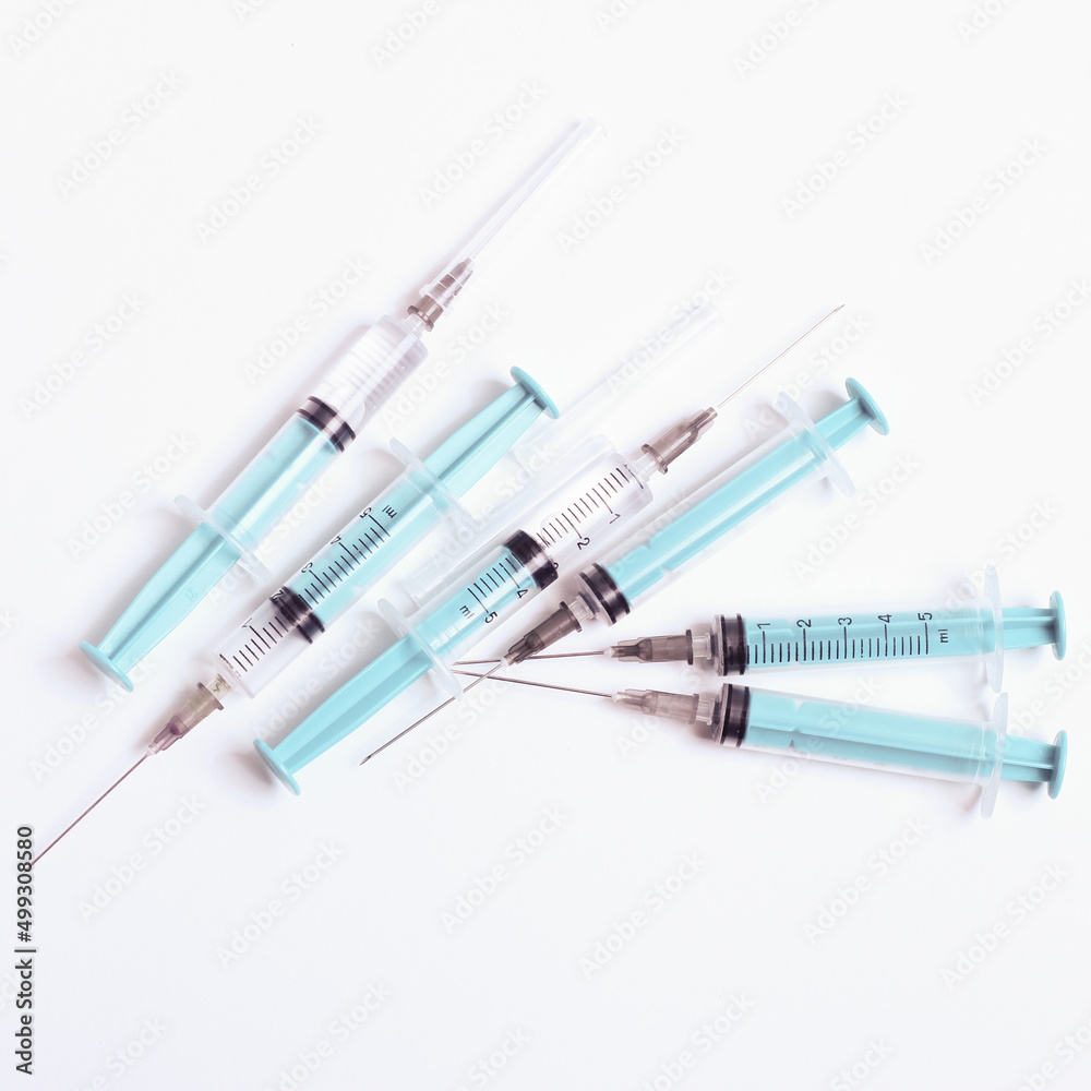 Medical syringe on a white background. A syringe for injection. The concept of health and beauty Medical syringe on a white background. A syringe for injection. The concept of health and beauty