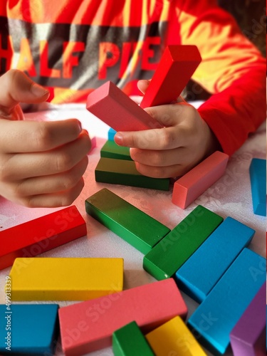 hand holding a block