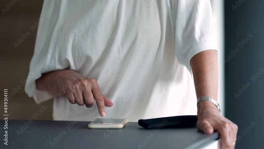Person using cellphone touching smartphone screen scrolling Person using cellphone touching smartphone screen scrolling