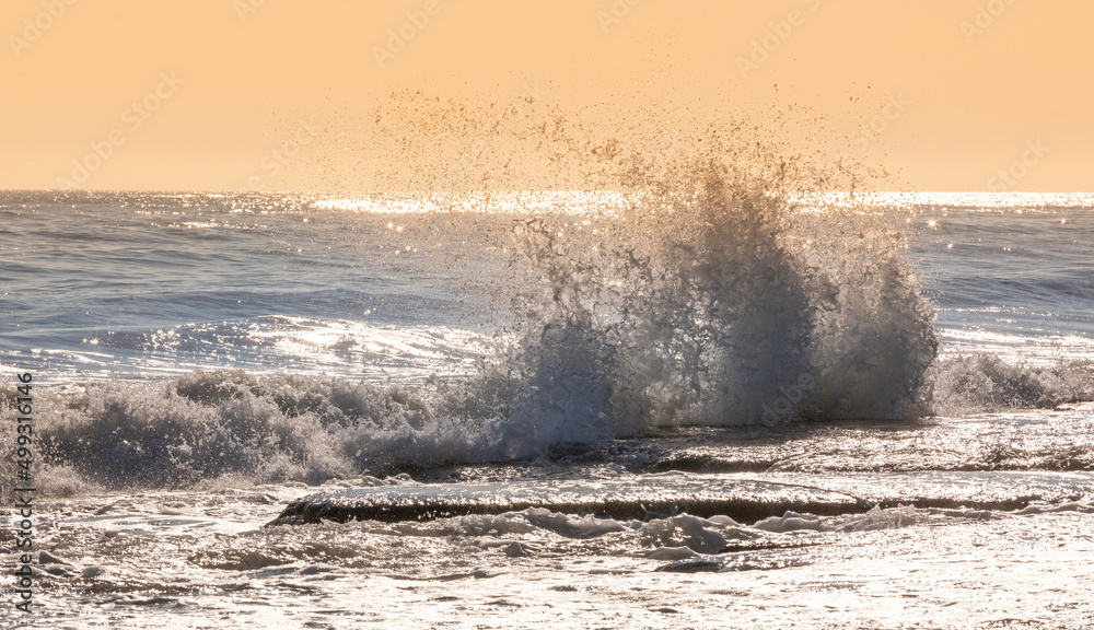 Naklejka premium Waves at sunrise at Caspian Sea