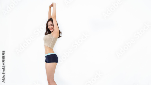 Portrait of beautiful healthy slim asian show armpit waxing woman casual with copy space white background. People beauty perfect body slim fit fitness sexy girl. Freedom lifestyle healthcare concept photo