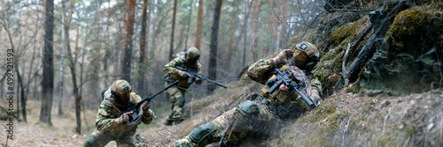 Fotografie, Obraz Three mercenaries during a clash in enemy territory