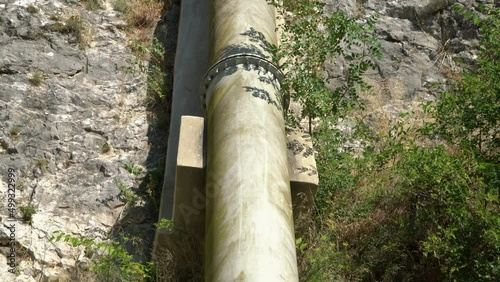 Big metal pipeline with gas, oil, water in the mountains. 
