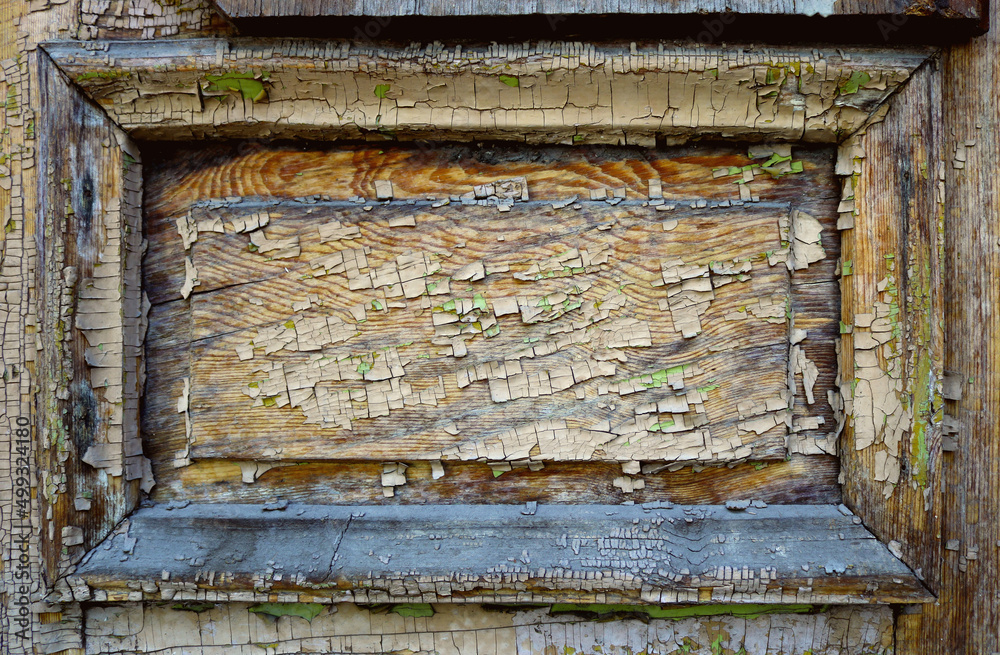 Naklejka premium weathered wooden rectangular surface with frame, peeling and chipped paint, craks, dust and lichen - blank background texture