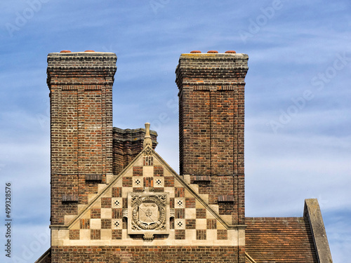 Fototapeta CAMBRIDGE, UK - AUGUST 11, 2017:  The impressive brick chimneys and gable on the