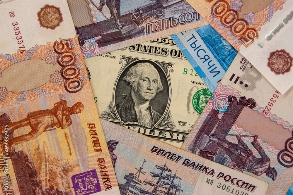 One dollar banknote surrounded by ruble banknotes