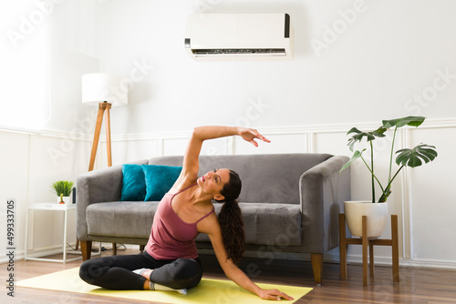 Beautiful woman working out with the ac on