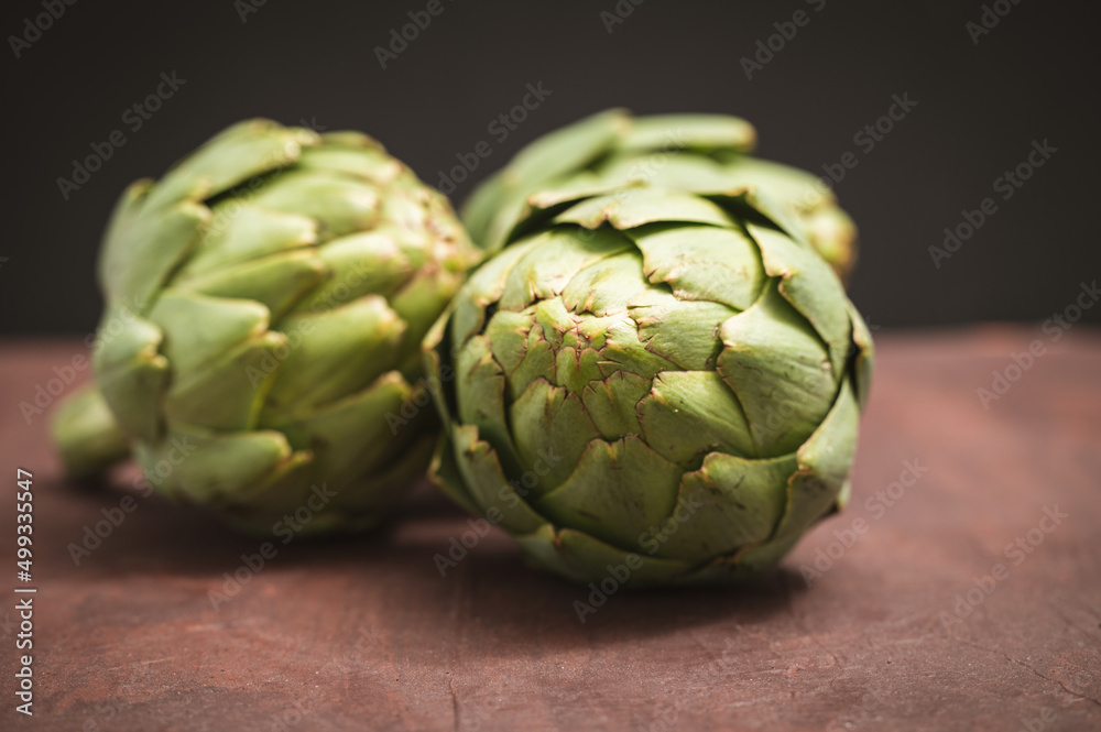 close up of artichoke on table close up of artichoke on table