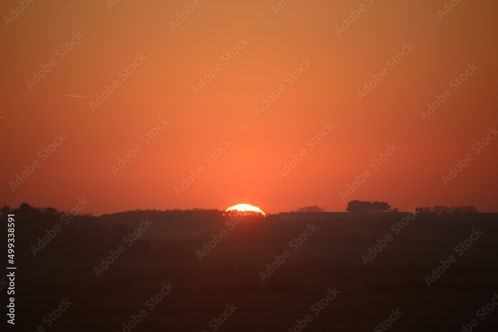 Sunset over the tidal marshes outside Blakeney in Norfolk, England during the autumn