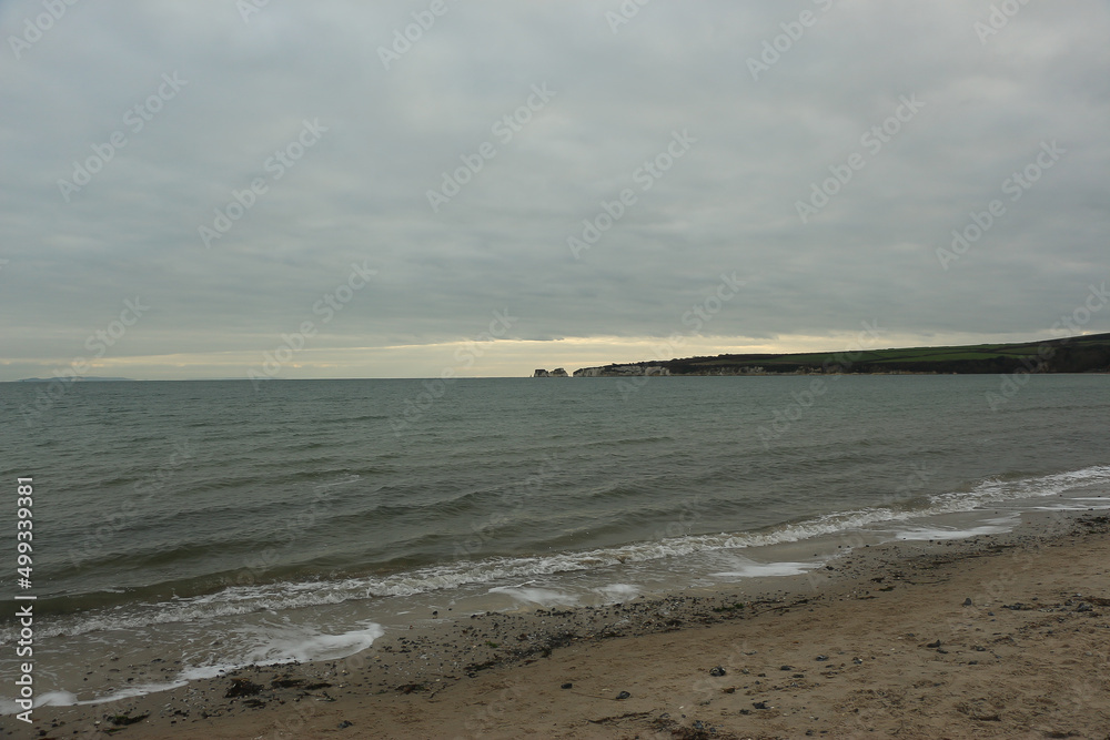 Exploring Studland Bay with views of Bournemouth and the Isle of Wight from the beach during the middle of winter Exploring Studland Bay with views of Bournemouth and the Isle of Wight from the beach during the middle of winter