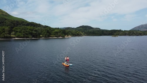 Paddle boarding, lake district, 4K lake, drone footage. This is a video of paddle boarding on lakes in the lake district England. 4K video footage. 