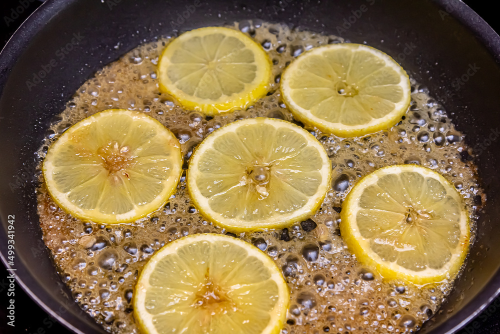 caramelized lemon slice on a lemon cake decorated with caramelized lemon slices caramelized lemon slice on a lemon cake decorated with caramelized lemon slices