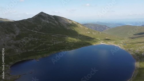 Striding Edge, Lake District, Uk mountain. UK drone footage. Striding edge tarn. Tarn and UK mountains. 4K drone footage of hills. UK countryside.  photo