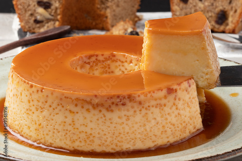 A piece of delicious condensed milk pudding. Selective focus. photo