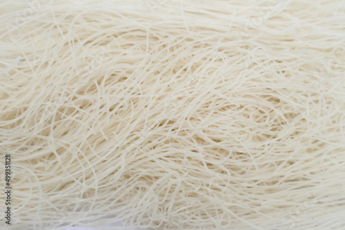 raw dry bihun or vermicelli or rice noodles or angel hair isolated on white background 
