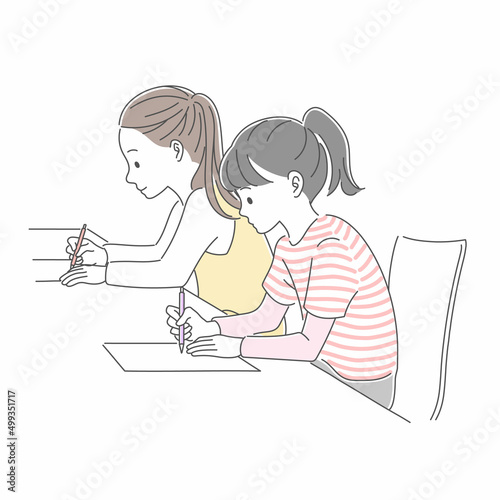 テストを受ける2人の私服の女子生徒