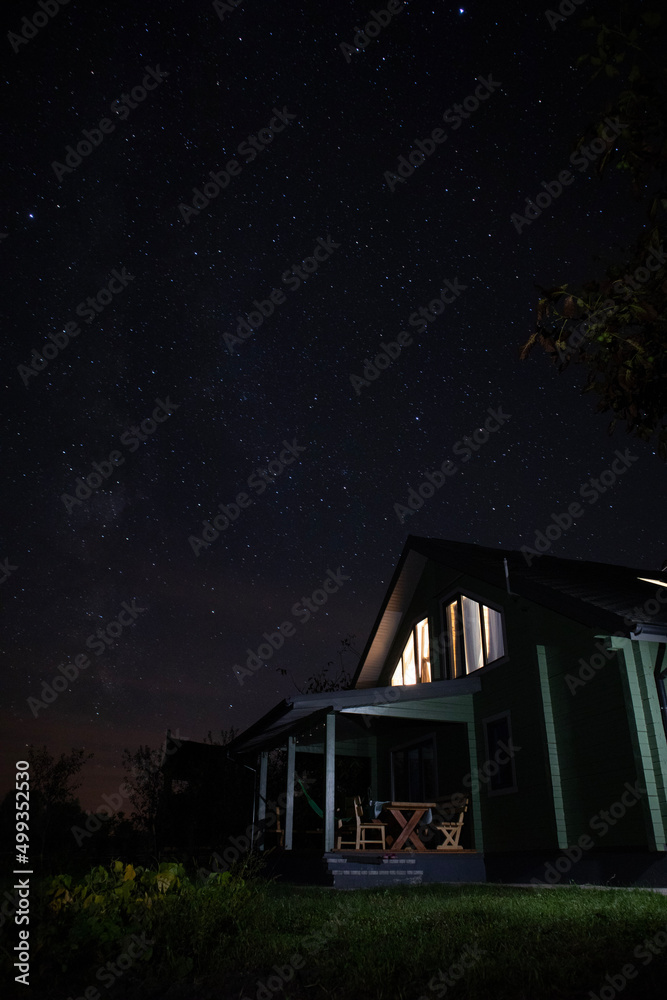 Country house under stary sky at night Country house under stary sky at night