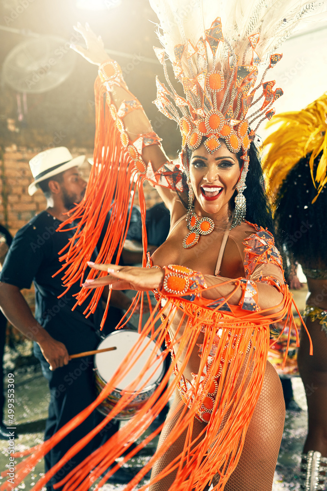 Let the beat take you away. Cropped portrait of a beautiful samba dancer performing at Carnival with her band.