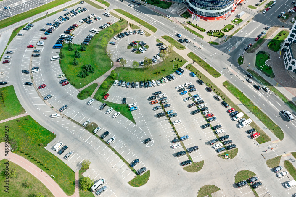 Obraz premium large parking lot in residential area. aerial view from flying drone.