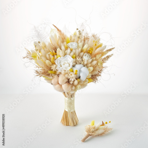 Beautiful yellow bouquet of dried flowers for the bride and groom