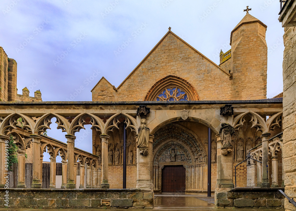 Medieval stone walls and the stained glass rose window of the Santa Maria la Real church in Olite, Spain famous for a magnificent Royal Palace castle