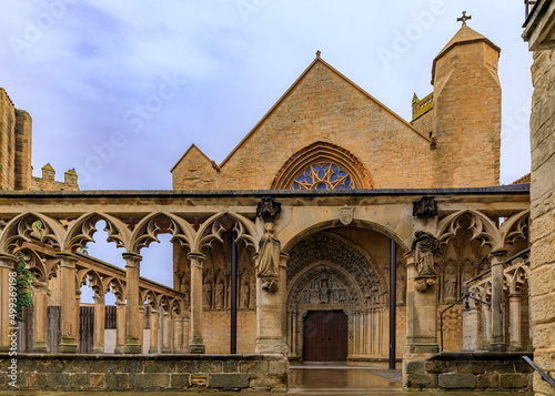 Medieval stone walls and the stained glass rose window of the Santa Maria la Real church in Olite, Spain famous for a magnificent Royal Palace castle