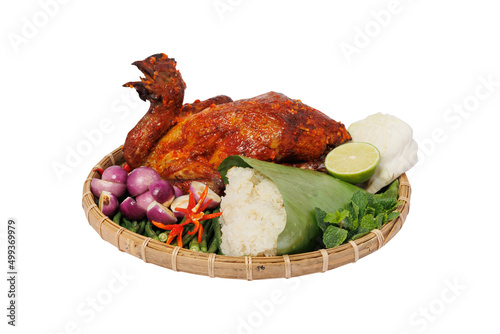 Grilled chicken and sticky rice decorated in flat winnowing basket. Traditional Vietnamese food photo