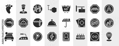 indications filled icons set. editable glyph icons such as four toe footprint, shield, crossing road caution, mine site, rain umbrella, no bomb jump, p inside a circle, ferry carrying cars vector.