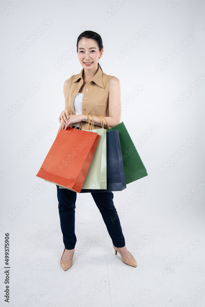 Woman holding paper bags on white background. Woman holding paper bags on white background.